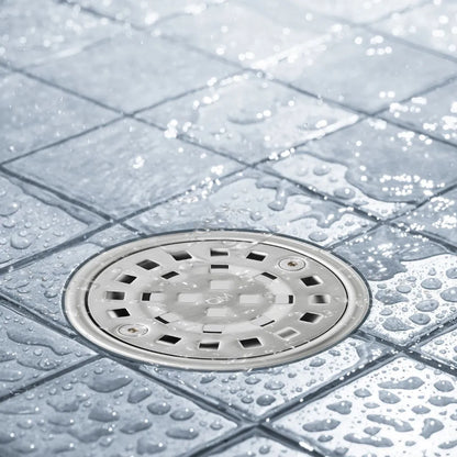 Bay Ria Round Center Drain by QM Drain installed in a modern shower. Stainless steel drain integrated into tiled floor, providing efficient water flow and sleek bathroom aesthetics.