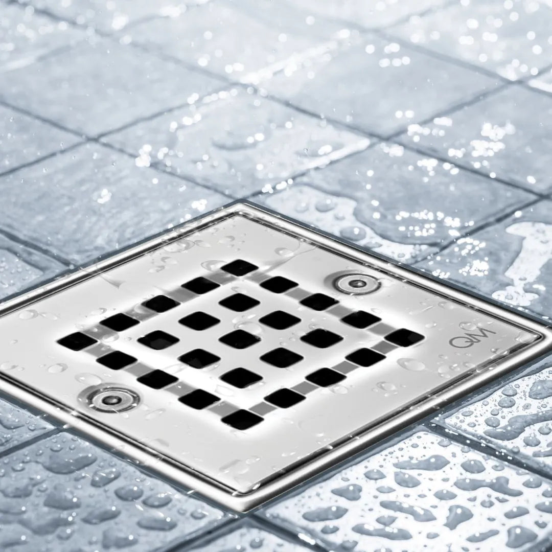 Bay Ria Square Drain by QM Drain installed in a modern shower setting. Stainless steel square grate integrated into tile floor for clean aesthetics and reliable drainage performance.