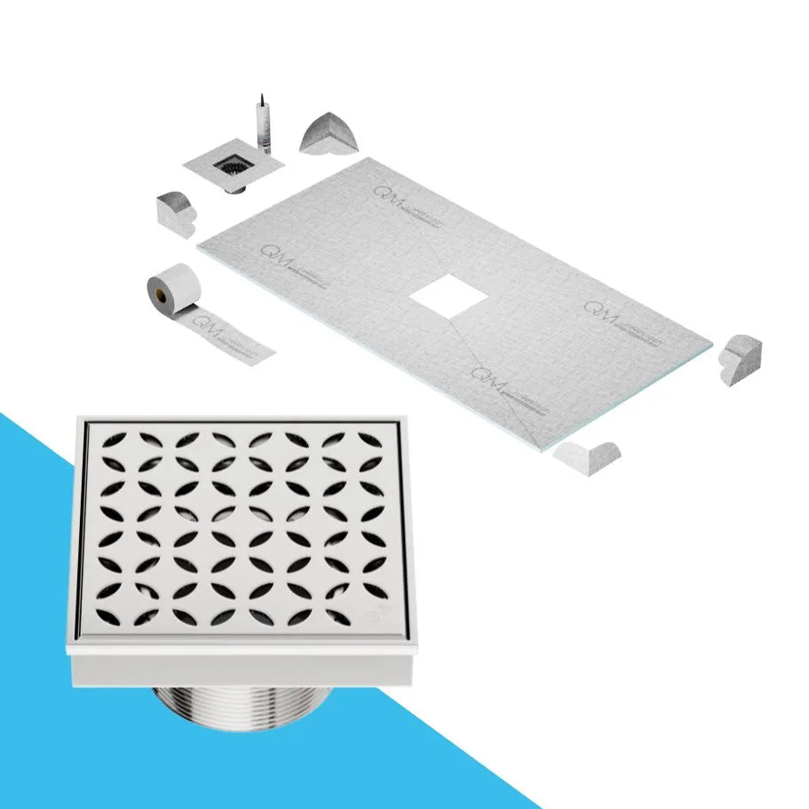 QM Drain Curbless Shower Pan with Delmar Lotus Center Square Drain, stainless-steel floral-pattern grate, available in Satin, Gold, Bronze, Polished, and Black finishes, offering elegant aesthetics and effective water drainage for luxury bathrooms.