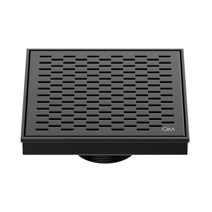 QM Drain Delmar Delta Square Drain 5 3/4-inch in Black finish, featuring a sleek stainless-steel square-pattern grate. This drain ensures efficient water drainage, seamless tile integration, and a modern, minimalist aesthetic, perfect for luxury shower and bathroom floor installations.