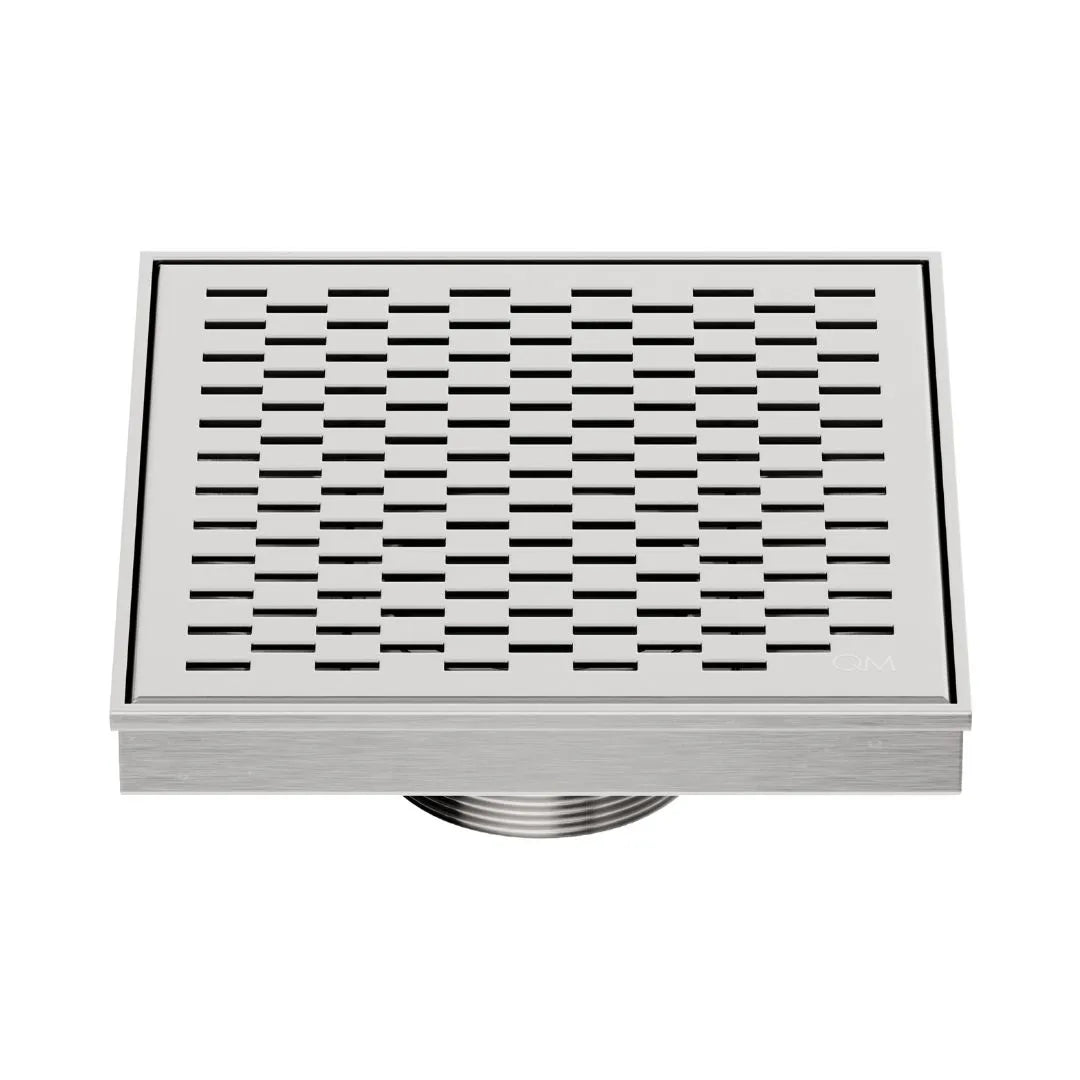 QM Drain Delmar Delta Square Drain 5 3/4-inch in Satin finish, featuring a sleek stainless-steel square-pattern grate. This drain ensures efficient water drainage, seamless tile integration, and a high-end polished aesthetic, perfect for luxury shower and bathroom floor installations.