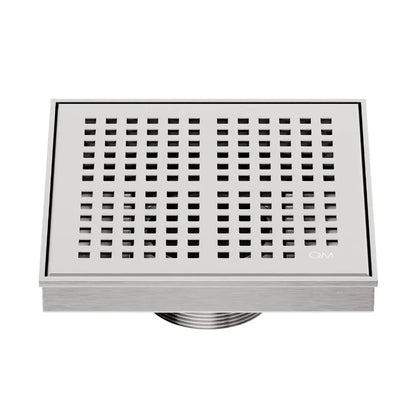 QM Drain Delmar Kai Square Drain 5 3/4-inch in Satin finish, featuring a sleek stainless-steel grate with fine square perforations. This drain offers efficient water drainage, seamless tile integration, and a high-end polished aesthetic, ideal for luxury shower and bathroom floor installations.