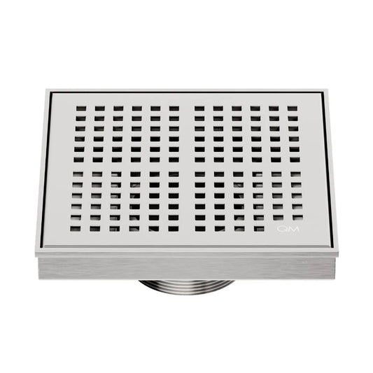 QM Drain Delmar Kai Square Drain 5 3/4-inch in Satin finish, featuring a sleek stainless-steel grate with fine square perforations. This drain offers efficient water drainage, seamless tile integration, and a high-end polished aesthetic, ideal for luxury shower and bathroom floor installations.