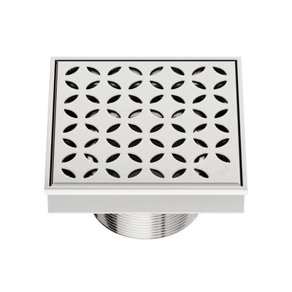 QM Drain Delmar Lotus Square Drain 4x4-inch in Polished finish, featuring a sleek stainless-steel channel with an elegant floral-pattern grate. This drain provides efficient water drainage, seamless tile integration, and a modern minimalist aesthetic, perfect for luxury shower and bathroom floor installations.
