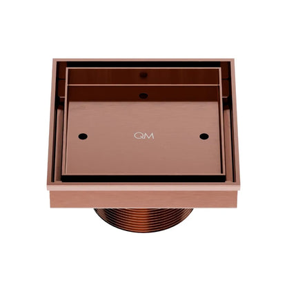 QM Drain Delmar Mist Tile-In Square Shower Drain 4x4-inch in Bronze finish, featuring a sleek stainless-steel channel with a 'mist' perforated grate design. This drain ensures seamless tile integration, efficient water drainage, and an elegant aesthetic for luxury shower and bathroom floor installations.