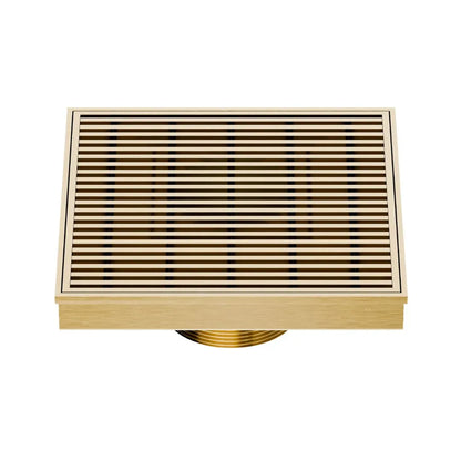 QM Drain Delmar Wedgewire Square Drain 5 3/4-inch in Gold finish, featuring a stainless-steel channel with a precision wedge-wire grate design. This drain offers efficient water drainage, seamless tile integration, and a luxurious aesthetic, ideal for high-end shower and bathroom floor installations.