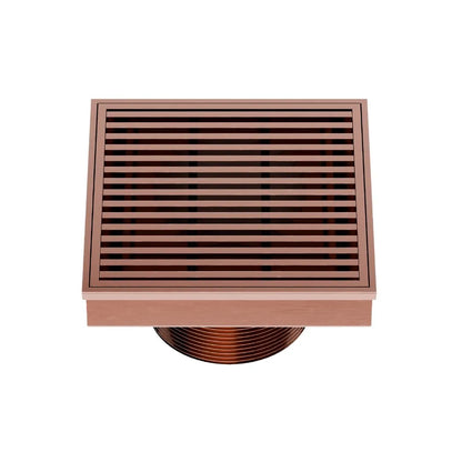 QM Drain Delmar Wedgewire Square Drain 4x4-inch in Bronze finish, featuring a stainless-steel channel with a precision wedge-wire grate design. This drain offers efficient water drainage, seamless tile integration, and an elegant aesthetic, ideal for luxury shower and bathroom floor installations.