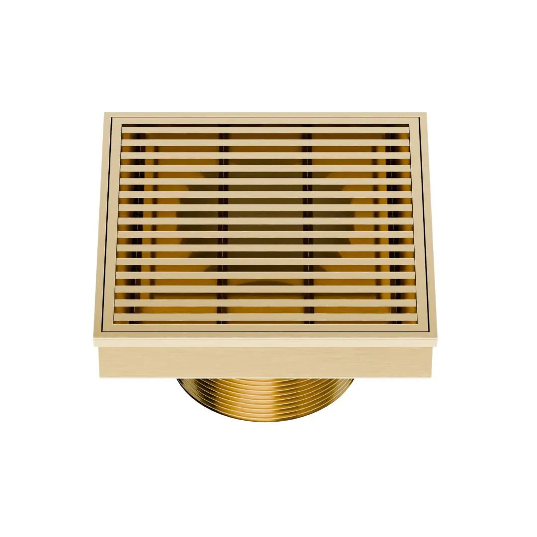 QM Drain Delmar Wedgewire Square Drain 4x4-inch in Gold finish, featuring a stainless-steel channel with a precision wedge-wire grate design. This drain provides efficient water drainage, seamless tile integration, and a luxurious aesthetic, perfect for high-end shower and bathroom floor installations.