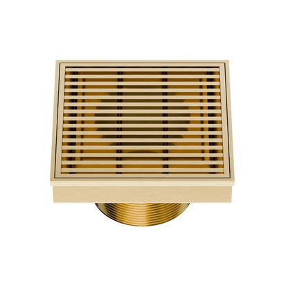 QM Drain Delmar Wedgewire Square Drain 4x4-inch in Gold finish, featuring a stainless-steel channel with a precision wedge-wire grate design. This drain provides efficient water drainage, seamless tile integration, and a luxurious aesthetic, perfect for high-end shower and bathroom floor installations.