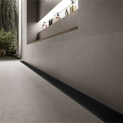 Modern shower floor showcasing the QM Drain Adjustable Wedgewire Linear Drain—stainless-steel channel with corrosion-resistant wedge-wire grate and adjustable frame, installed flush within large-format tiles for seamless integration and efficient high-flow water.
