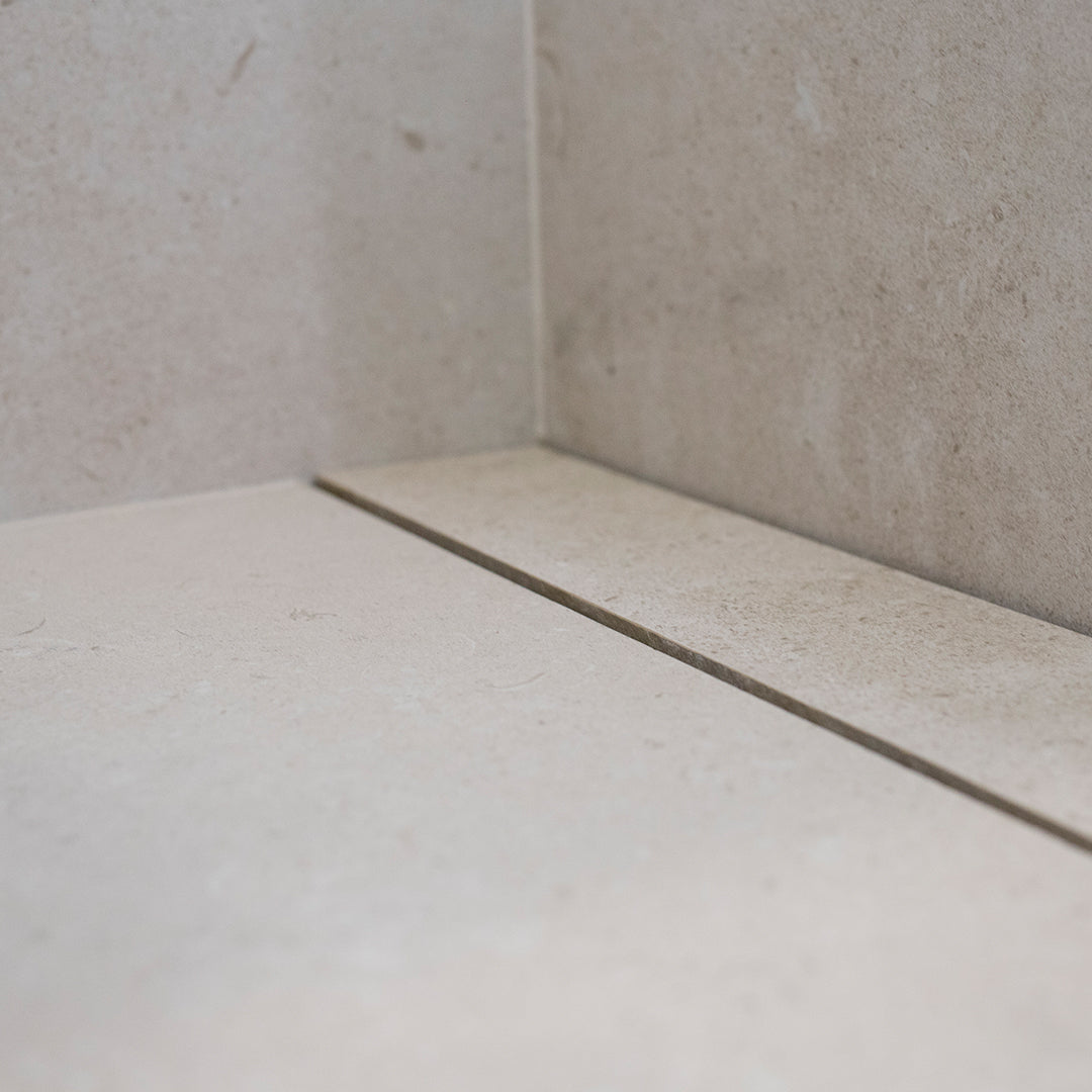 QM Drain Invisible Linear Drain installed seamlessly on a bathroom floor, offering a sleek, minimalist design. The image highlights the drain's efficient water drainage, smooth tile integration, and modern aesthetic, ideal for high-end bathroom installations that prioritize both functionality and style.