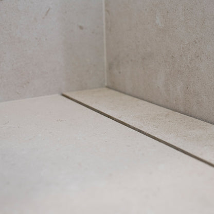 QM Drain Invisible Linear Drain installed seamlessly on a bathroom floor, offering a sleek, minimalist design. The image highlights the drain's efficient water drainage, smooth tile integration, and modern aesthetic, ideal for high-end bathroom installations that prioritize both functionality and style.
