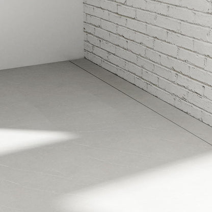 Close-up view of QM Drain Invisible Linear Drain installed in a curbless shower, highlighting the seamless integration into the floor. The zoomed-in image emphasizes the sleek, minimalist design, efficient water drainage, and modern aesthetic, ideal for luxury, barrier-free shower installations.