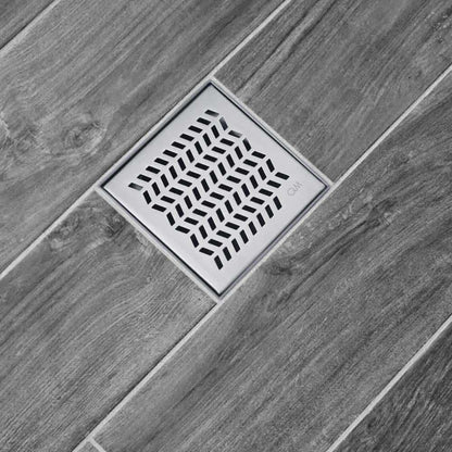 QM Drain Delmar Nami Square Drain 4-inch, featuring a sleek stainless-steel grate with modern perforations. This drain ensures efficient water drainage, seamless tile integration, and a minimalist design, ideal for luxury shower and bathroom floor installations.