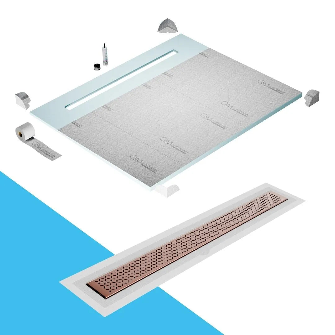 QM Drain Shower Pan with Delmar Lotus Flange Edge Linear Drain, stainless-steel decorative floral grate design, integrated flange for seamless tile installation, efficient drainage, offered in Satin, Gold, Bronze, Polished, and Black finishes.