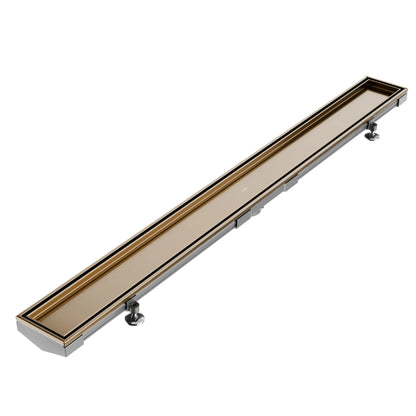 QM Drain Mist (Tile-In) Adjustable Lagos Linear Drain with 2-inch outlet in Champagne finish, featuring a stainless-steel channel with fine perforated 'mist' grate. This adjustable drain offers seamless tile integration, efficient water drainage, and a modern minimalist aesthetic for luxury shower installations.