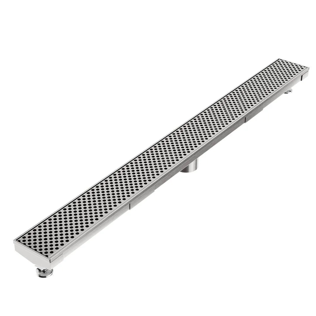 Modern shower floor showcasing the Perforated Adjustable Kit Delmar Linear Drain in Polished finish with 2″ outlet—stainless-steel adjustable channel featuring precision perforated grate, integrated flange beneath surrounding tiles, and versatile on-site frame for customizable, high-performance drainage.