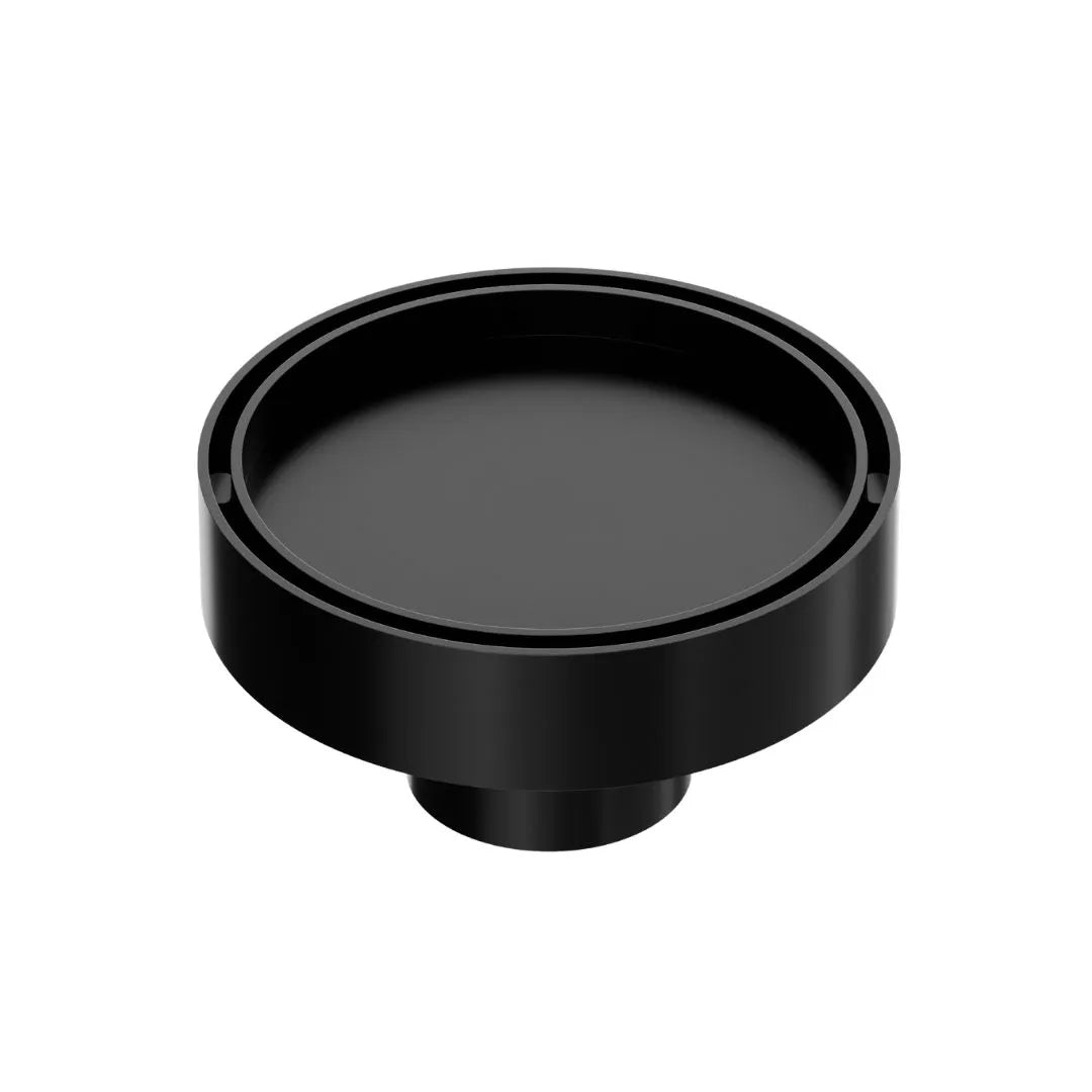 QM Drain Mist Couture Round Drain in Black finish, available in 4”x 4” and 5 ¾”x 5 ¾” sizes. This elegant stainless-steel drain features a fine perforated circular grate, providing efficient water drainage while seamlessly integrating into modern luxury shower and bathroom installations.