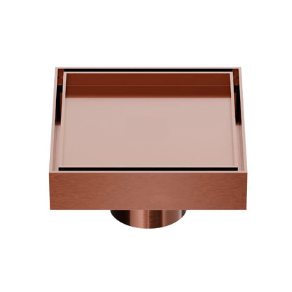 QM Drain Mist Couture Square Drain in Bronze finish, available in 4”x 4” and 5 ¾”x 5 ¾” sizes. This sleek stainless-steel drain features a fine perforated grate for efficient water drainage, offering seamless integration into modern shower floors with a minimalist, luxury aesthetic.