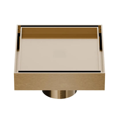 QM Drain Mist Couture Square Drain in Champagne finish, available in 4”x 4” and 5 ¾”x 5 ¾” sizes. This sleek stainless-steel drain features a fine perforated grate for efficient water drainage, offering seamless integration into modern shower floors with a minimalist, luxury aesthetic.