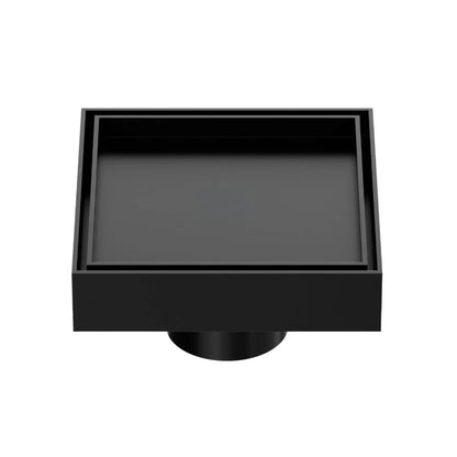 QM Drain Mist Couture Square Drain in Black finish, available in 4”x 4” and 5 ¾”x 5 ¾” sizes. This sleek stainless-steel drain features a fine perforated grate for efficient water drainage, offering seamless integration into modern shower floors with a minimalist, luxury aesthetic.