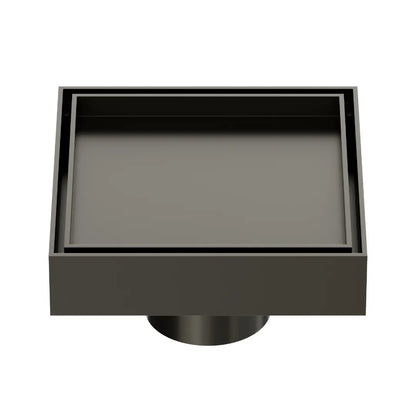 QM Drain Mist Couture Square Drain in Luxe Gray finish, available in 4”x 4” and 5 ¾”x 5 ¾” sizes. This sleek stainless-steel drain features a fine perforated grate for efficient water drainage, offering seamless integration into modern shower floors with a minimalist, luxury aesthetic.