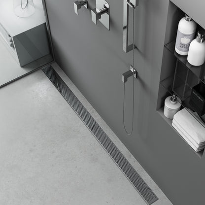 Modern shower floor showcasing the QM Drain Delta Polished Linear Drain—sleek stainless-steel channel installed at the shower threshold, featuring a minimalist slot grate, integrated waterproof flange, and efficient high-flow drainage for contemporary luxury bath designs.