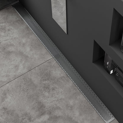 Modern bathroom web banner showcasing the QM Drain Delta Satin Linear Drain—sleek stainless-steel channel drain against a soft gray tile background, featuring minimalist slot grate, integrated waterproof flange, and text overlay highlighting satin finish and high-flow performance.