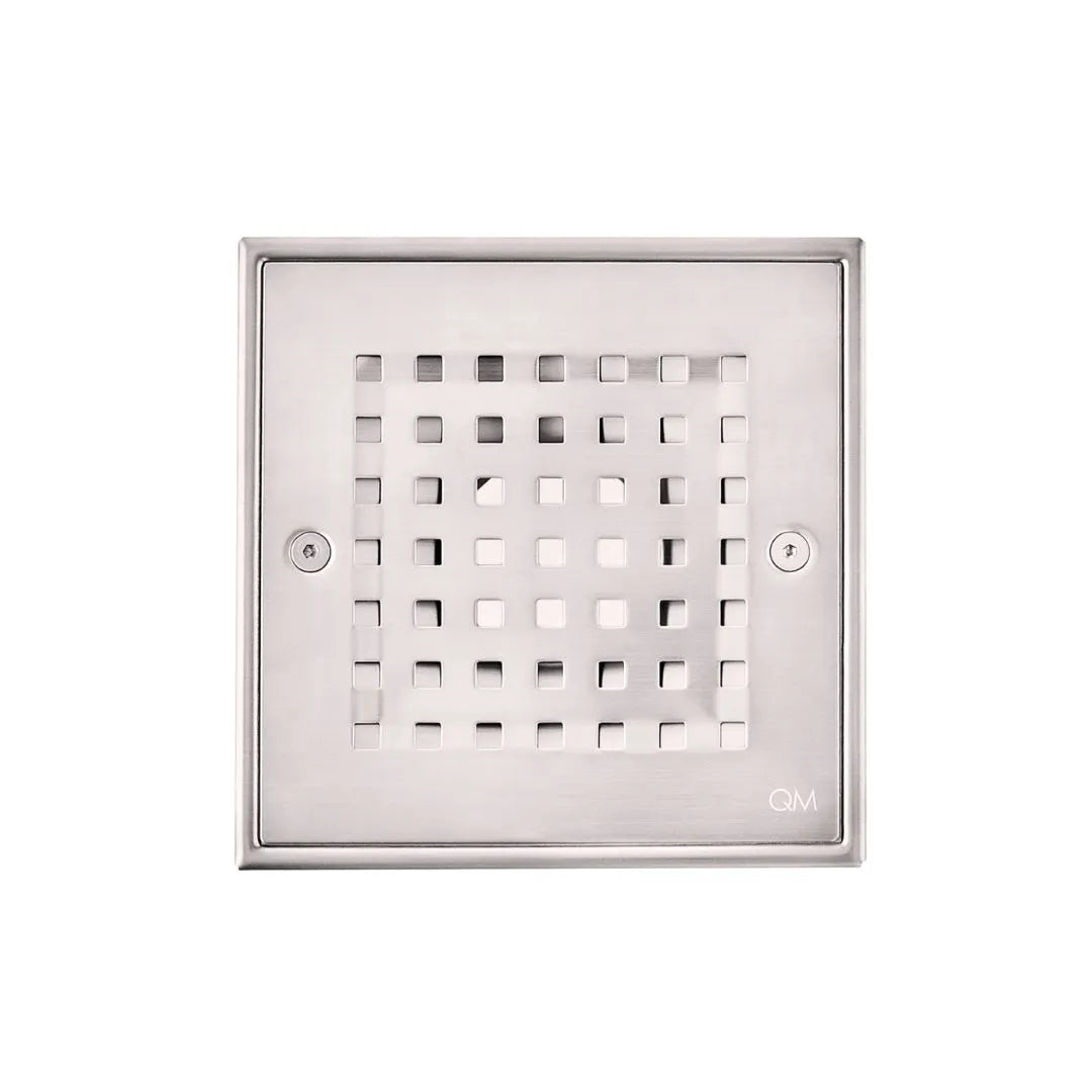 Close-up view of stainless steel square shower drain cover with perforated Ria grate design.