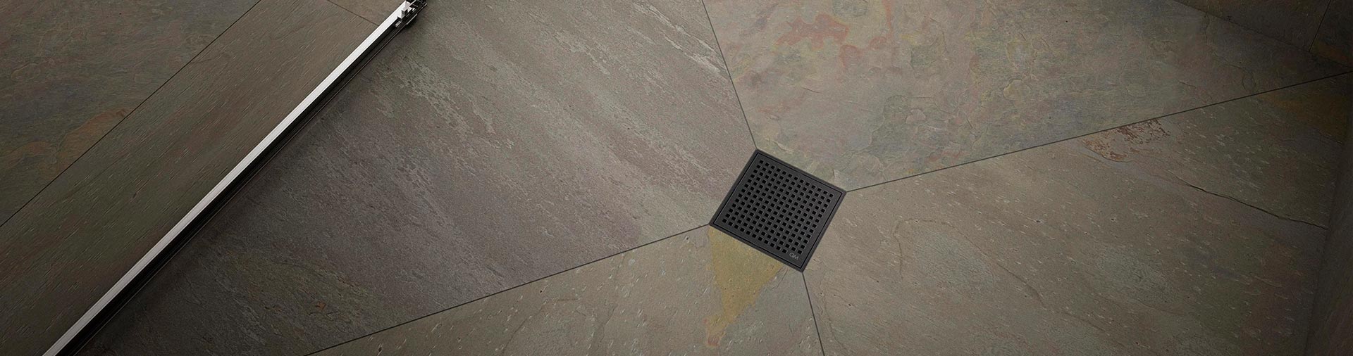 QM Drain Mira Square Drain, featuring a sleek stainless-steel grate with fine perforations for efficient water drainage. This square drain offers seamless integration into modern luxury shower and bathroom floors, with a minimalist design available in multiple finishes.
