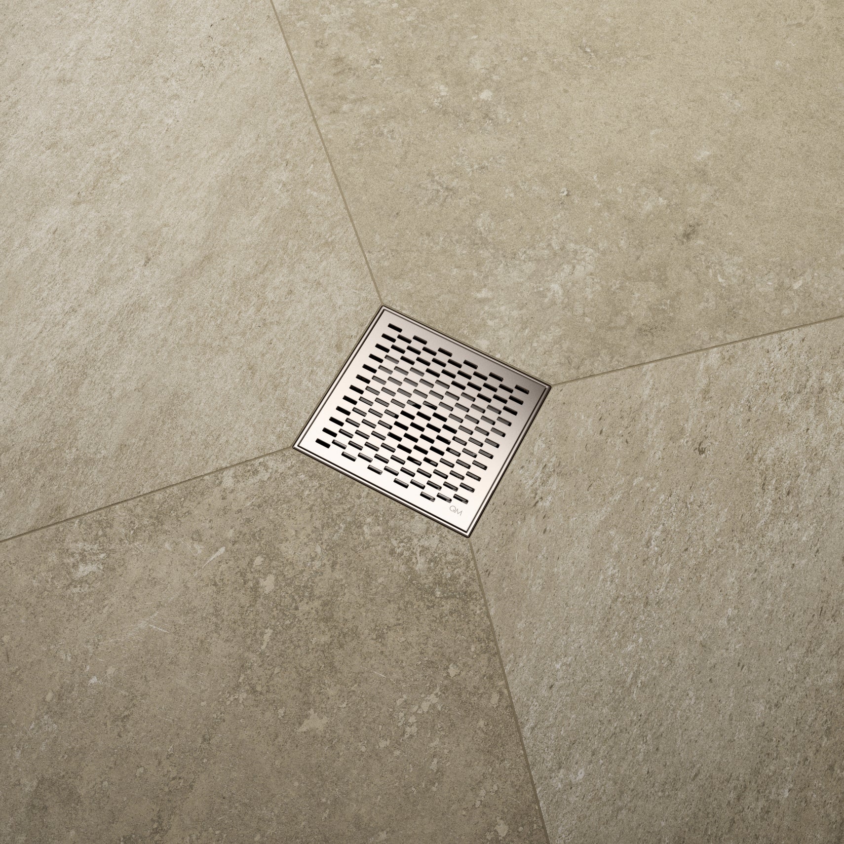 QM Drain Delmar Delta Square Drain installed in a luxury bathroom, showcasing a sleek stainless-steel square-pattern grate. The image highlights efficient water drainage, seamless tile integration, and a modern, minimalist design that complements high-end shower and bathroom installations.